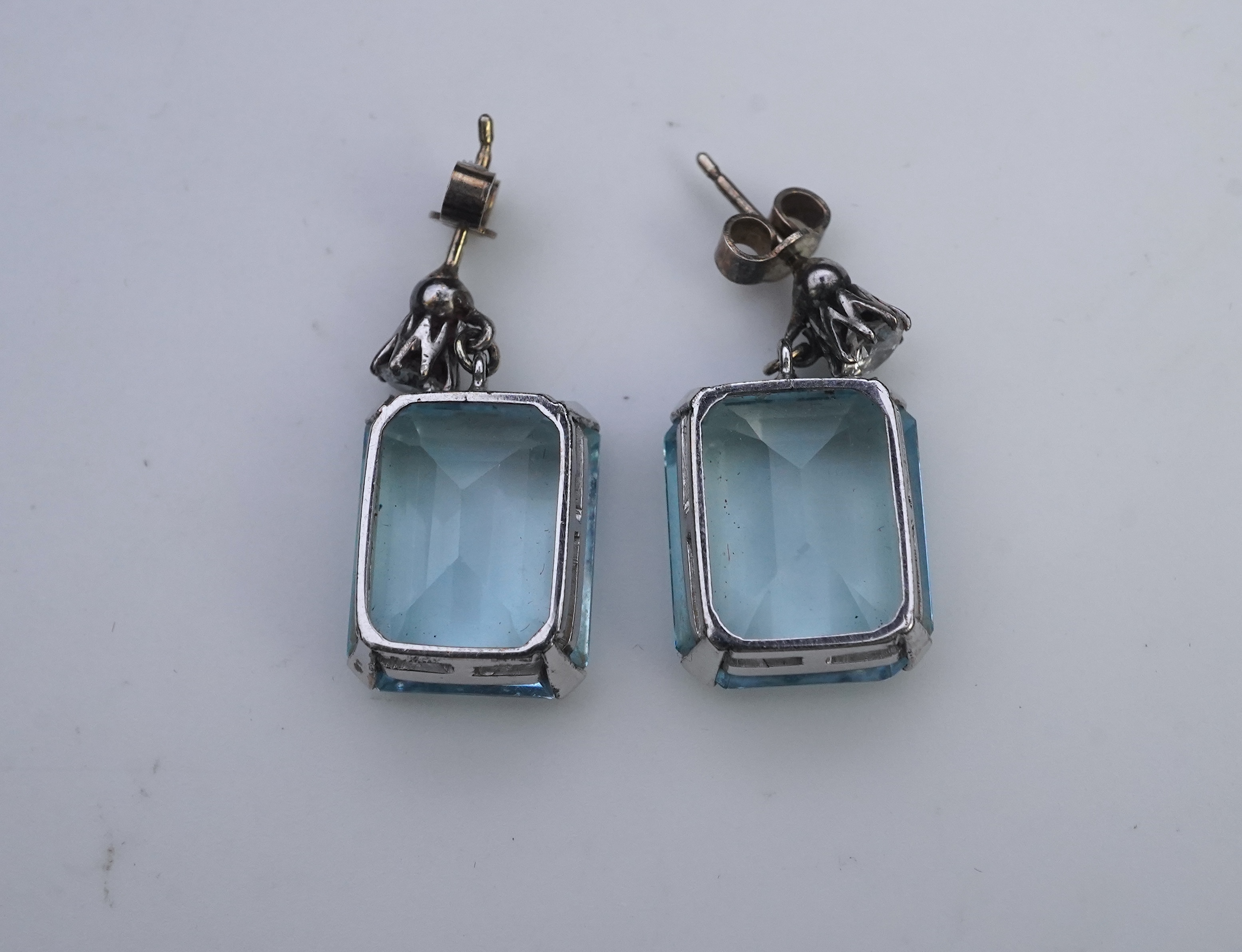 A pair of aquamarine and diamond earrings